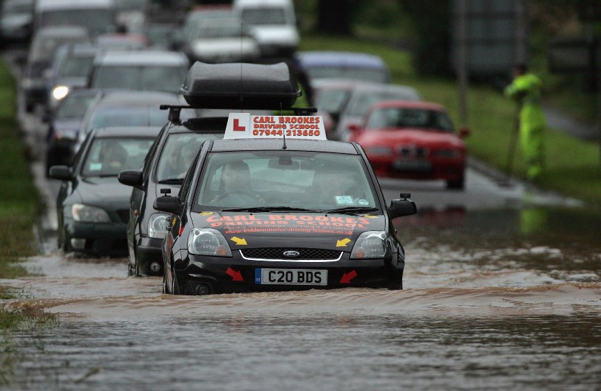 Cars driving on flooded road